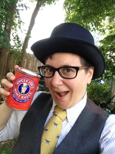 podcast superstar Jo in top hat and tie, holding a can of Uncle Joe's Mint Balls, featuring an old man in a top hat